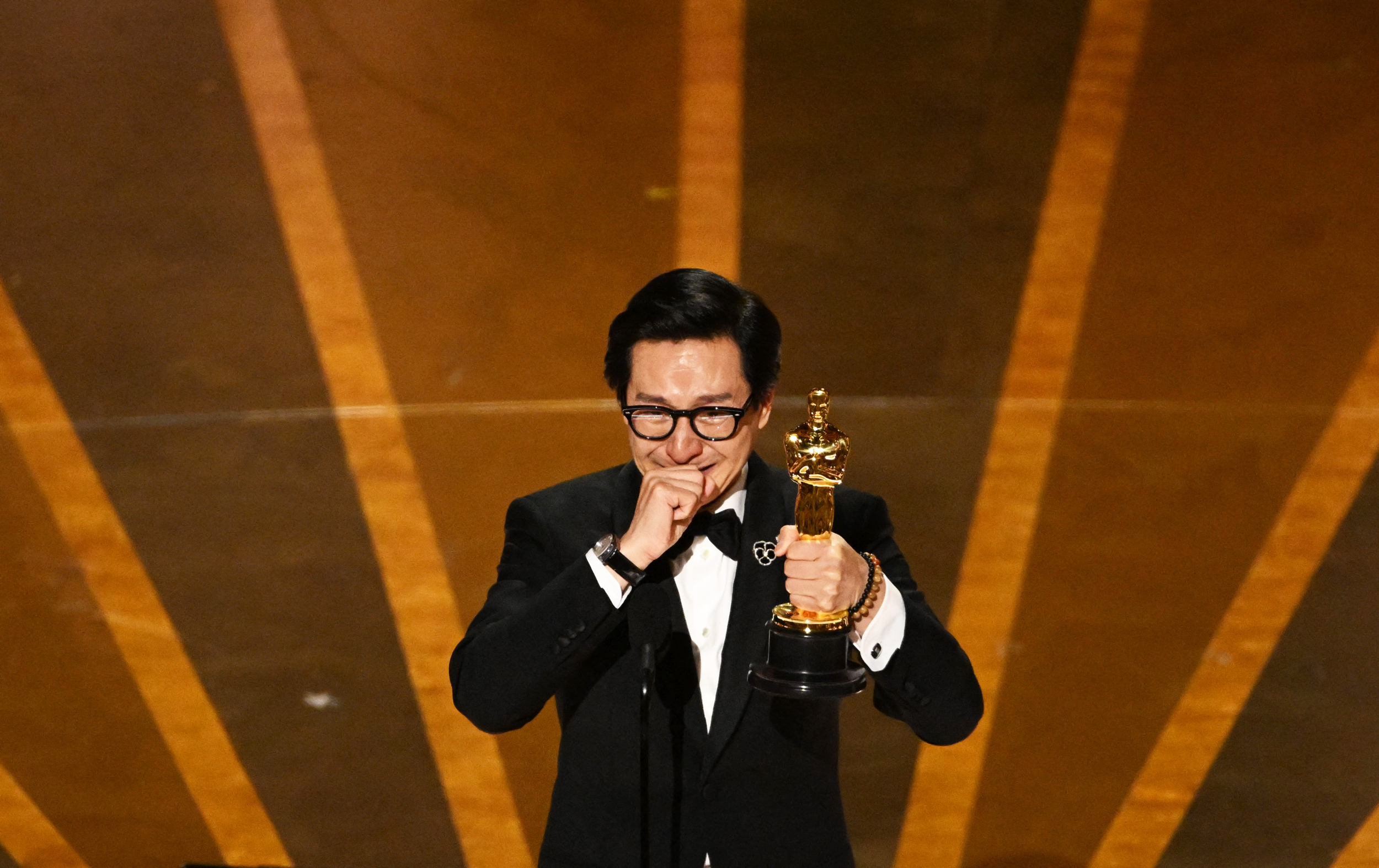 US-Vietnamese actor Ke Huy Quan accepts the Oscar for Best Actor in a Supporting Role for "Everything Everywhere All at Once" onstage during the 95th Annual Academy Awards at the Dolby Theatre in Hollywood, California on March 12, 2023. (Photo by Patrick T. Fallon / AFP) (Photo by PATRICK T. FALLON/AFP via Getty Images)